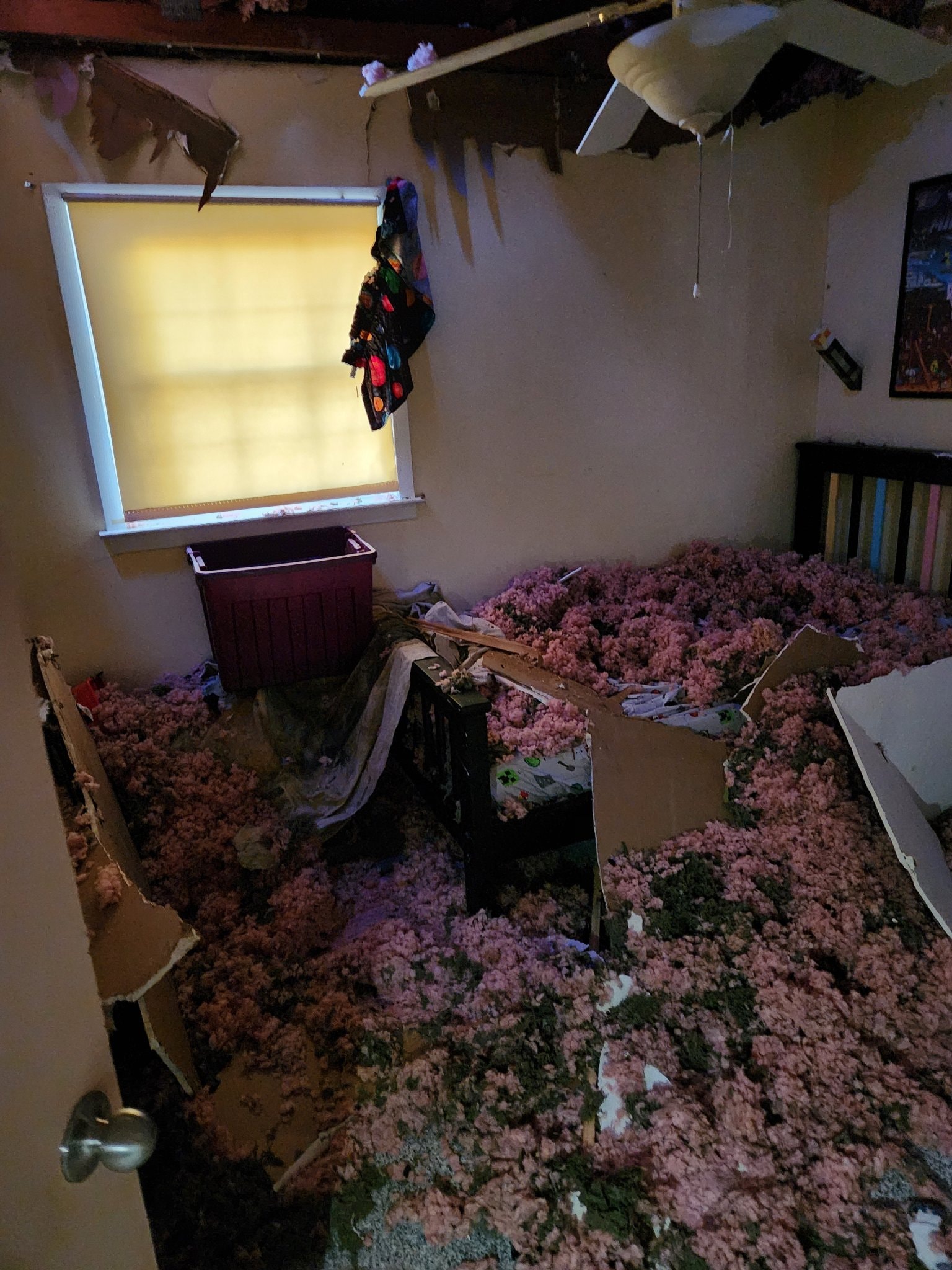 Ceiling collapse in a bedroom after water damage