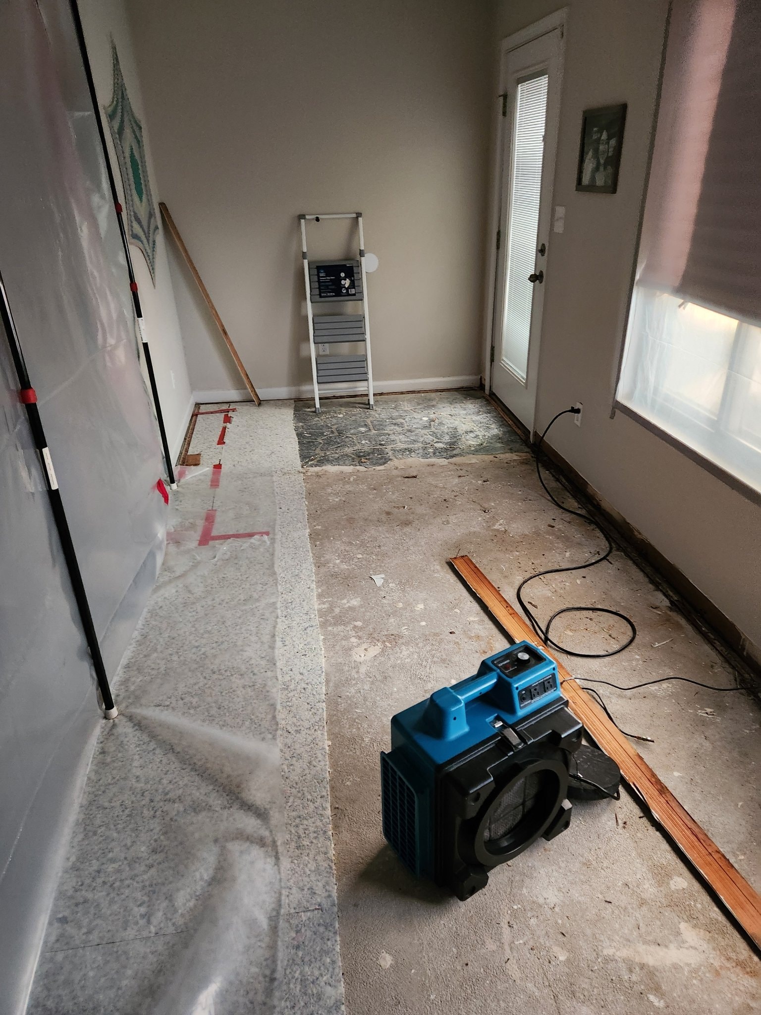 Air scrubber running in a room during demolition